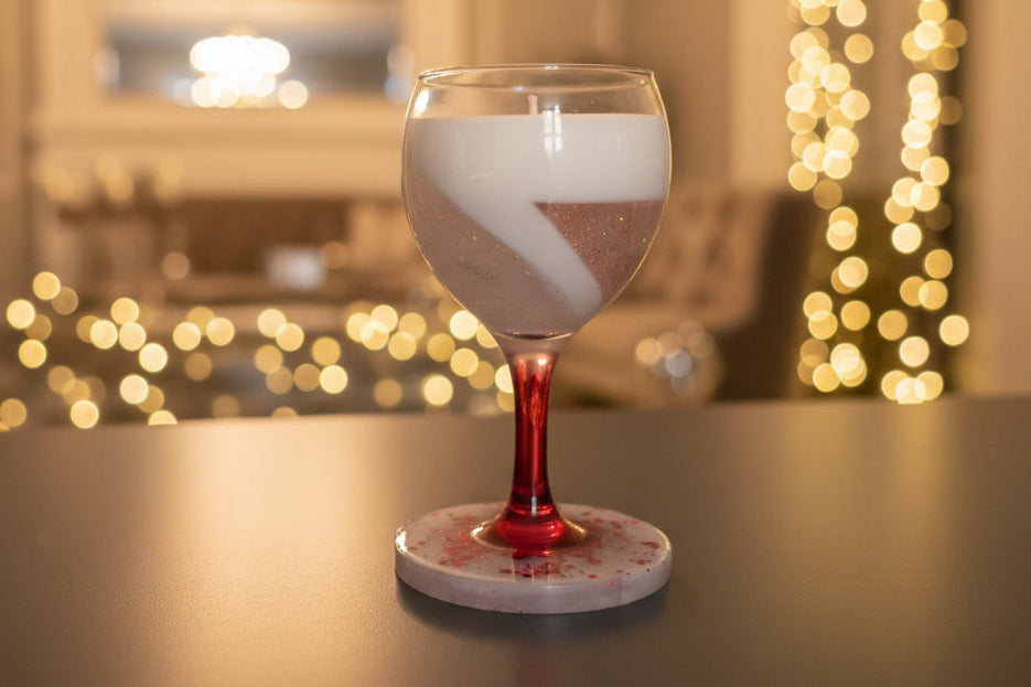 Wine glass candle in coaster